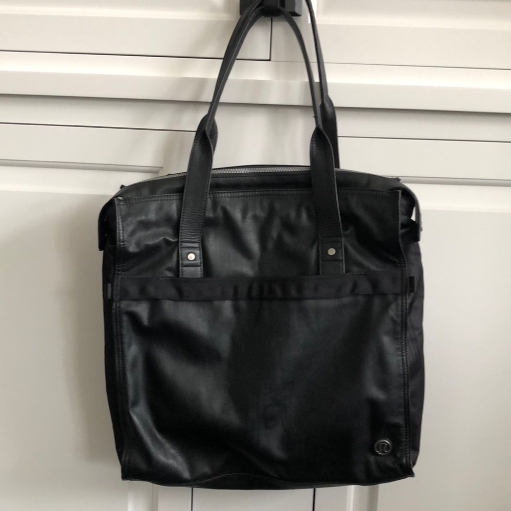 Black Lululemon bag. Zippers on top. Many compartments inside. Good condition